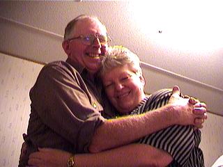 dad and mom hugging in the office