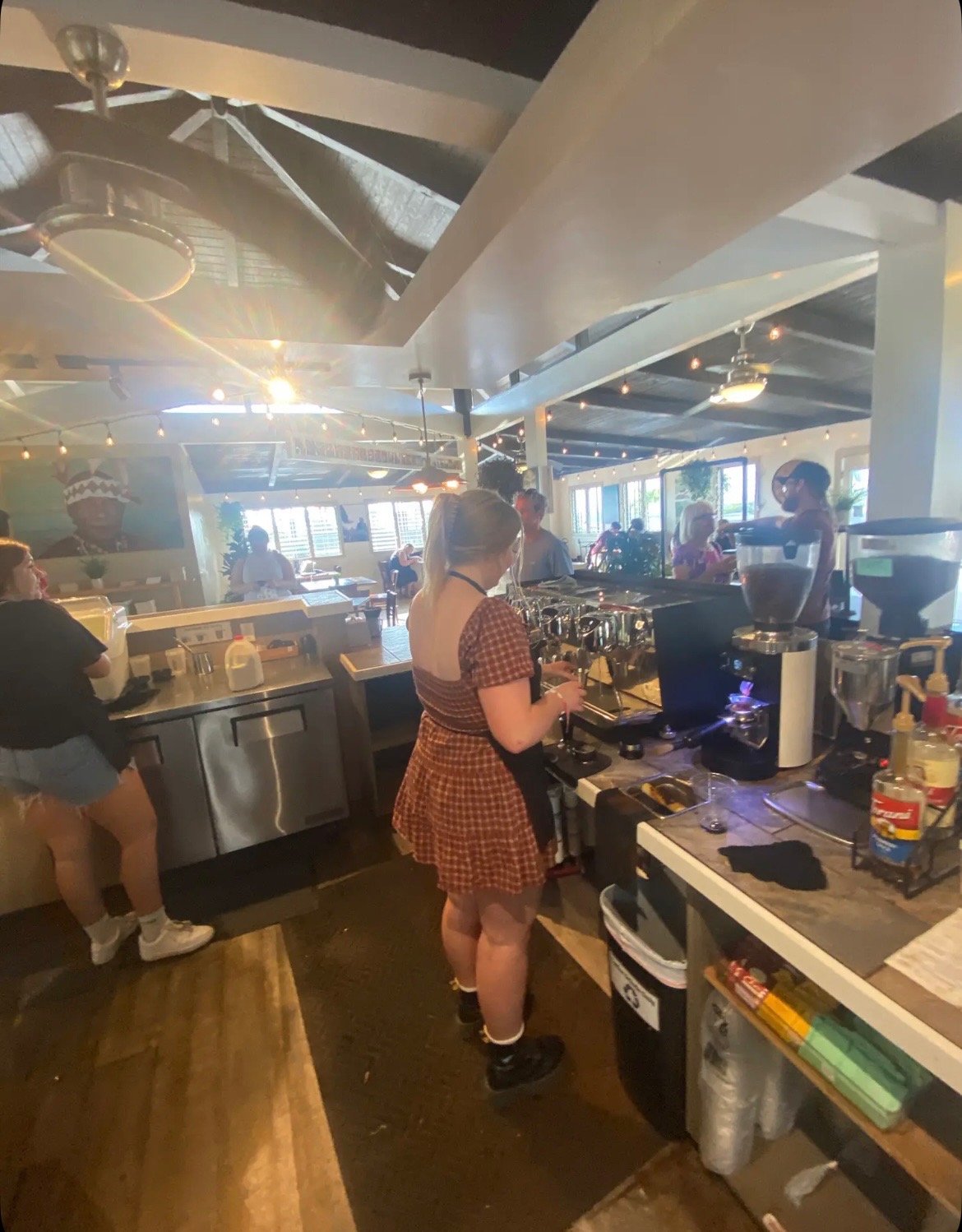 Sofia working at the coffee shop in Hawaii